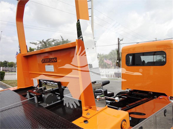 Orange Peterbilt truck body with metal ramp and Jerrdan branding visible on the side panel.