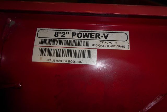8'2'' Power-V label on a red surface with barcode and serial number sticker.
