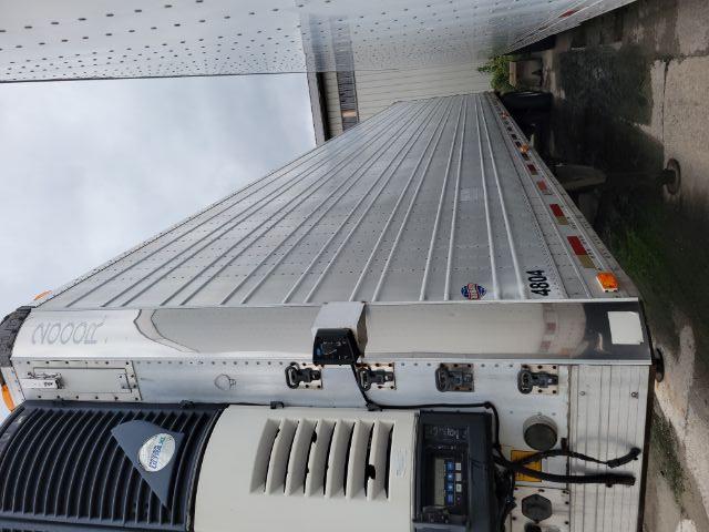 2000 Utility 2000R refrigerated trailer side view showing Thermo King unit at front with door, #4804 on lower side and vertical corrugated aluminum panels.
