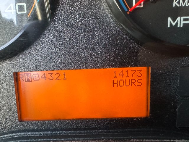 Instrument cluster LCD showing hours: 14173 HOURS and an odometer 04321? with orange backlight.