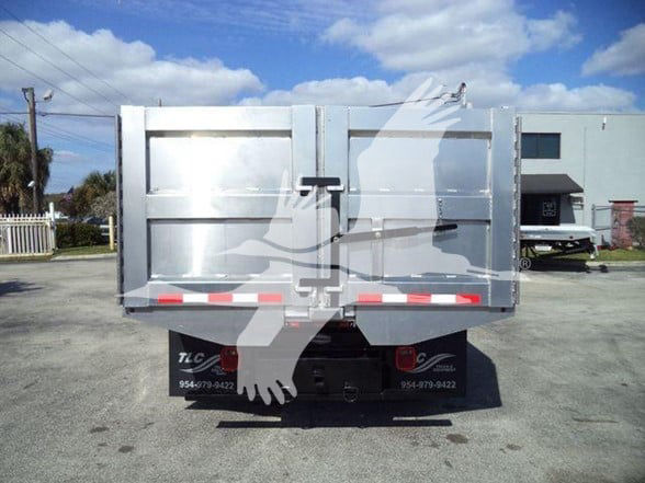 Isuzu NPR HD dump truck tailgate and bed showing rear view