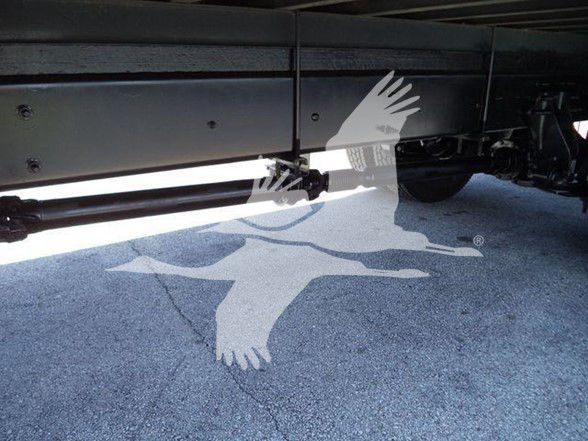 Underbody of a 2019 International DURASTAR 4300 truck showing suspension components and chassis side rail.
