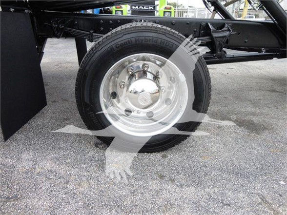 Truck wheel and dual rear axle shown with hub, tire labeled Continental Hybrid? and metal rim. Partial undercarriage visible.