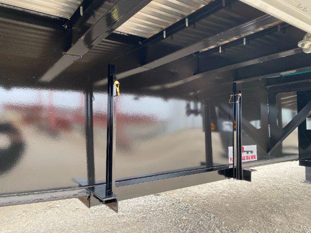Trailer axle framing with undercarriage supports and glossy black finish; undercarriage with frame rails and support legs visible.