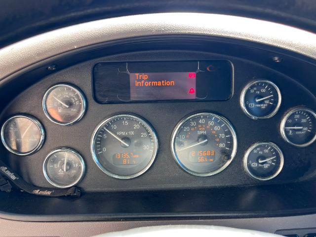 Peterbilt dashboard showing multiple gauges and a center digital display reading 'Trip Information' in orange text.