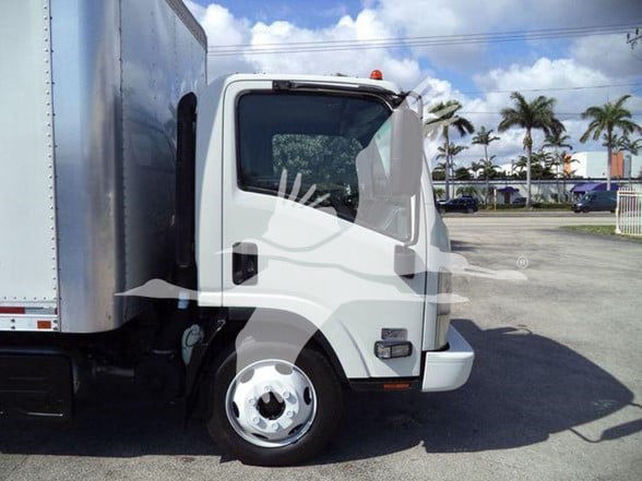 Isuzu NRR box truck cab and front fender visible from driver side with white paint.
