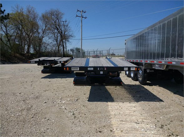 Fontaine 40TON mechanical detachable double drop trailer deck showing flatbed with dual rear axles and wheel ramps.