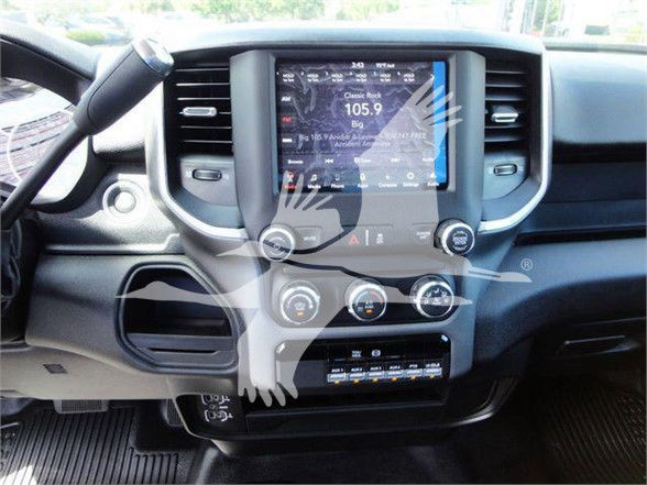 Ram 4500 dashboard center stack with touchscreen display showing radio 105.9 and climate controls.