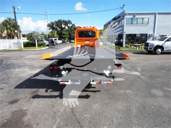 Peterbilt 337 tow truck flatbed rear with hitch and lights; stock number J56611 visible in the listing data.