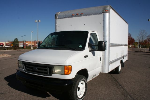 Ford E-Series box truck showing cargo box and front cab with white paint and black bumper.