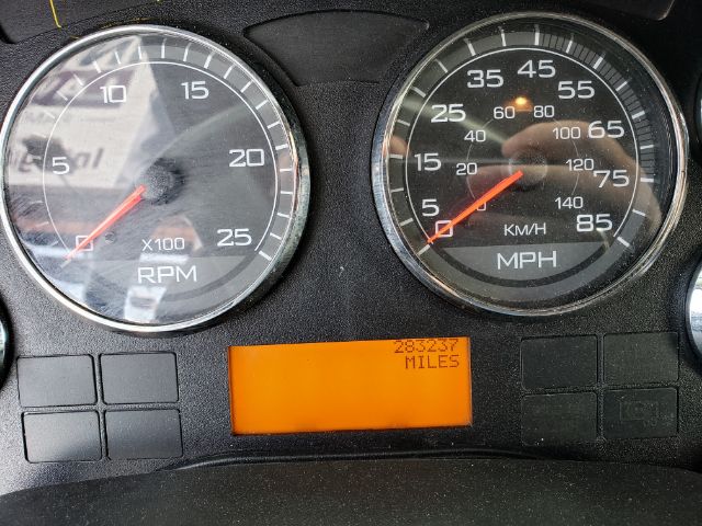 Dashboard gauges showing RPM x1000 and speedometer in MPH with an orange mileage display reading MILES.