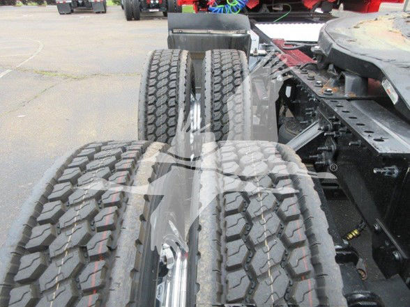 Volvo VNL64T740 truck chassis showing dual rear axles with heavy-duty tires and frame