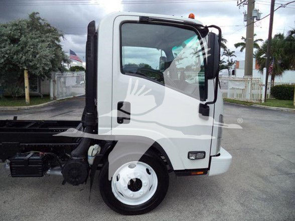 Truck cab side view of a white 2017 Chevrolet W4500 dump truck with black chassis and wheel shown; cab door window and side mirror visible.