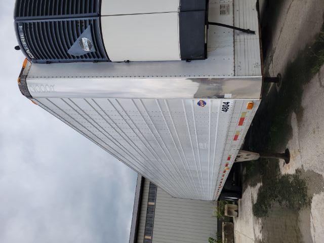 Utility trailer 2000R with Reefer unit at front, silver exterior, side view showing roller-mounted landing gear and Gen-Set refrigeration unit.