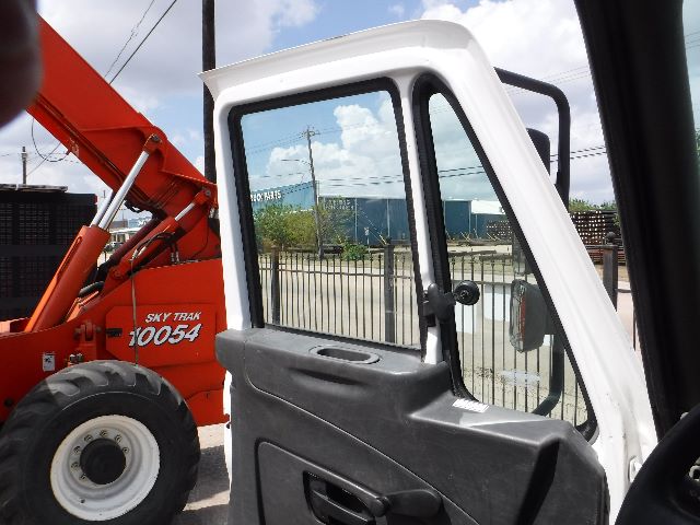 Truck cab interior window view of a 2018 International 4300 flatbed truck.