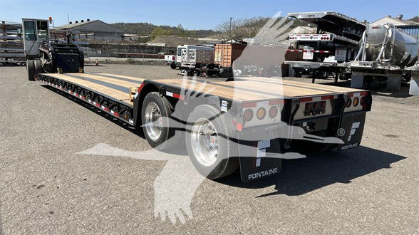 Fontaine N20 lowboy trailer with pony motor showing rear and side view, wooden deck, dual rear axles, hydraulic ramp, and branding on mud flaps.