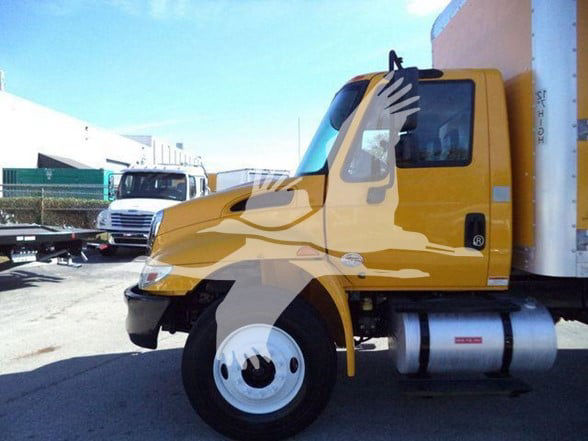 Side view of a yellow 2019 International DURASTAR 4300 box truck. Visible text includes a small badge on the door, and a cylindrical fuel tank under the cab.