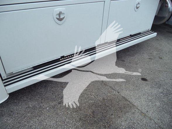Peterbilt 337 truck side step area with storage compartments and running boards visible.
