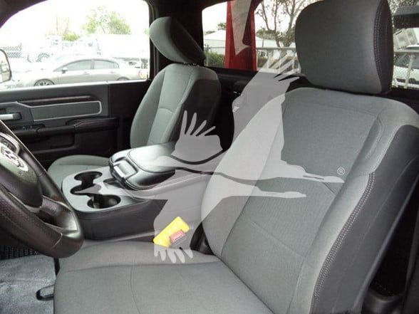 Ram 4500 interior showing front seats, center console, and cup holders.