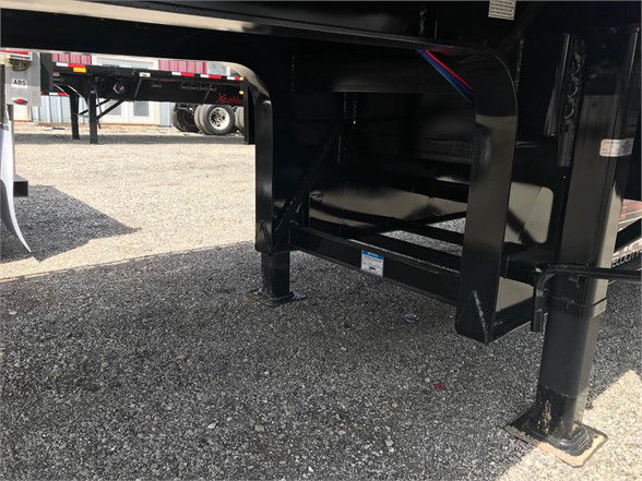 Fontaine VELOCITY trailer undercarriage showing support legs and frame with black paint and steel construction.