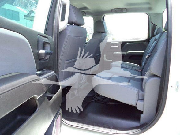Interior of 2023 International CV truck with open rear passenger door showing seating and cabin area.