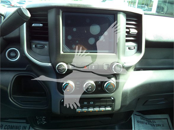 Ram 5500 dashboard center console showing touchscreen display and climate control knobs.