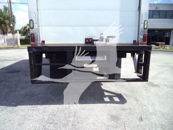 Rear view of a refrigerated truck trailer with a black metal bumper frame.