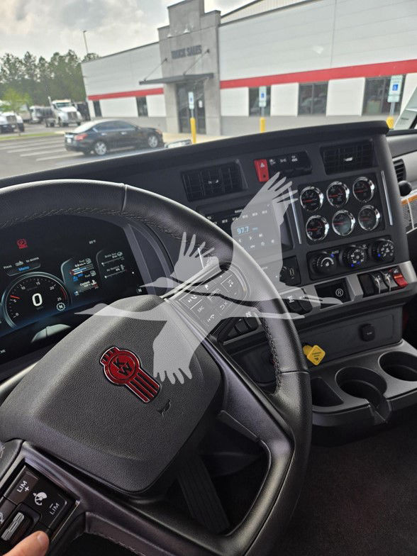 Kenworth T680 interior dashboard and steering wheel with instrument cluster and control panel.
