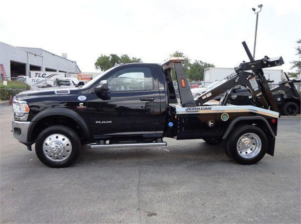 2024 Ram 4500 HD SLT tow truck side view showing wheel rims and towing equipment.