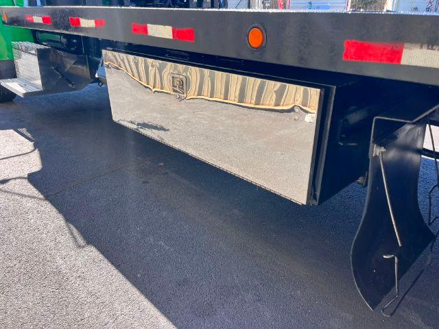 Peterbilt 348 rollback trailer rear showing polished toolbox and undercarriage components