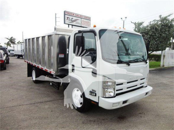 Isuzu NQR dump truck with white cab and silver dump bed; watermark overlays. Front grille, headlights, and side mirror visible; vehicle sits in a lot.