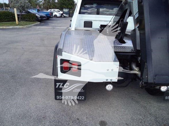Ram 5500 SLT pickup truck rear with aluminum diamond plate bed and taillight visible