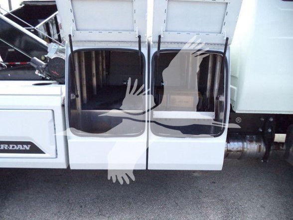 Truck cab doors open showing interior and steps; Mercedes-style dual side openings with chrome fuel intake and undercarriage visible.