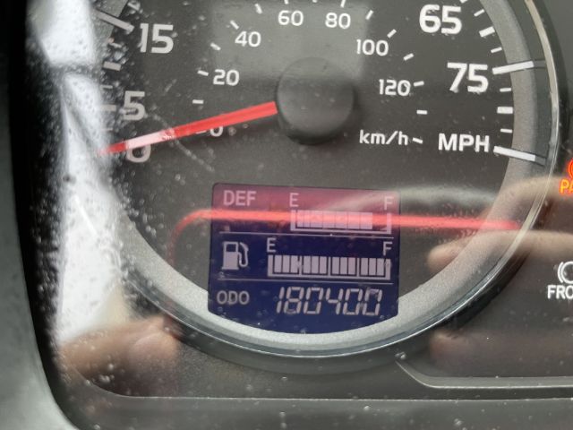 Dashboard of a 2017 Hino 268 box truck showing fuel gauge, odometer 187,400 miles, and digital readout with E-F levels.
