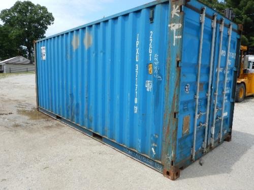 Blue 20' weather-tight shipping container with white lettering and numbers along the doors and side, corner castings, rust marks at the base.