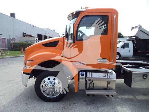 Orange Kenworth T280 side view showing cab and front wheel with chrome hubcap.