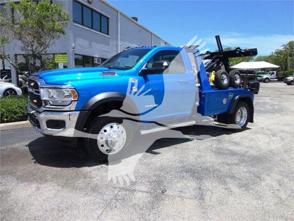 2025 Ram 4500 SLT tow truck front-left angle showing blue body with tow equipment and extended cab.