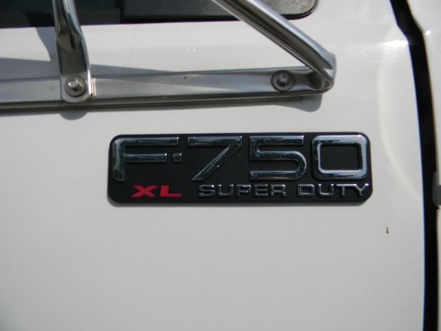 F-750 XL Super Duty badge on door of 2011 Ford F-750 Super Duty Crew Cab truck.