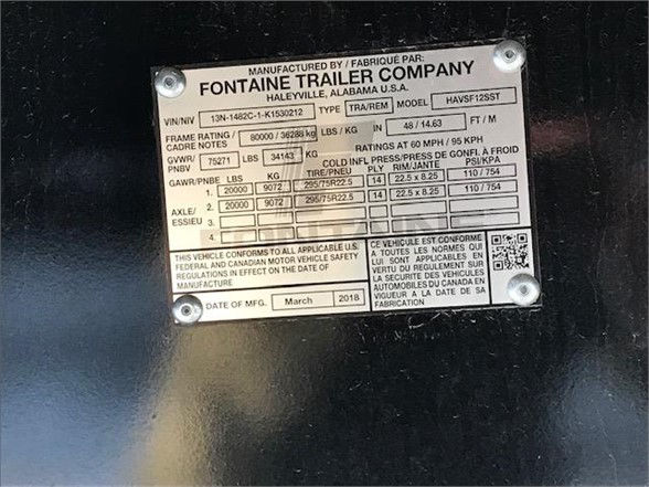 Manufacturer plate on Fontaine trailer showing VIN, type, model, weights and tire specs. Text includes MANUFACTURED BY FONT... FONTaine TRAILER COMPANY, HALLEVILLE, ALABAMA USA, U.S.A. Varies frame rating and axle ratings, tire size 22.5/25