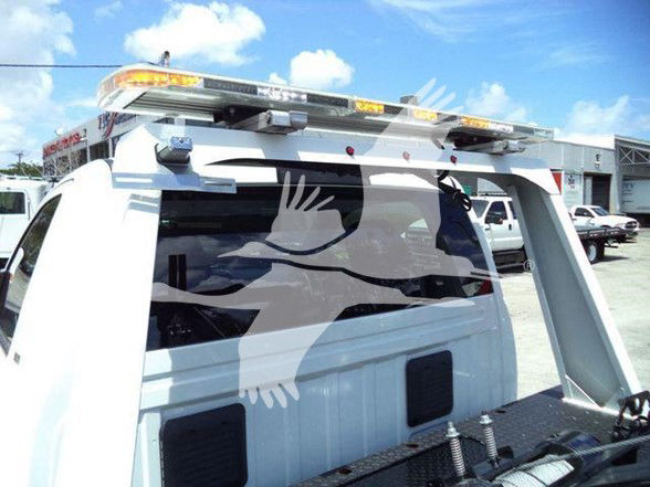 Ram 4500 truck rear with roof-mounted light bar, visible cab and bed components, generic tow configuration.