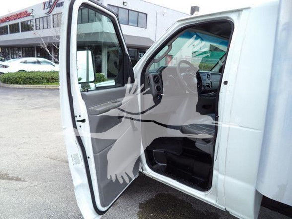 Ford E-450 box truck interior with driver door open showing dashboard and seating.
