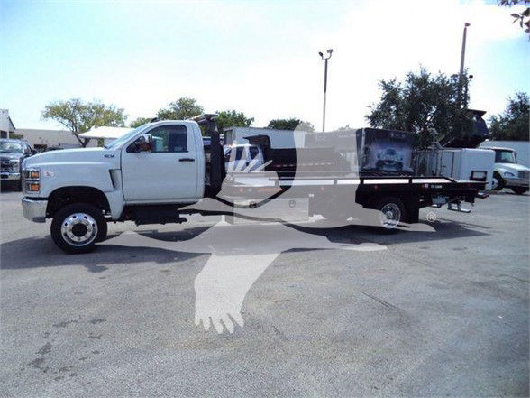 Truck: 2023 International CV in a white crew cab with a flatbed and crane attachment, VIN 1HTKTSWK2PH441633, stock J41633.