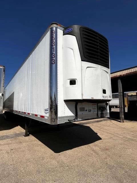 2015 CIMC Cool Globe refrigerated trailer with front refrigeration unit, white exterior, roll-up doors, and vertical measurement markings on front corner post.