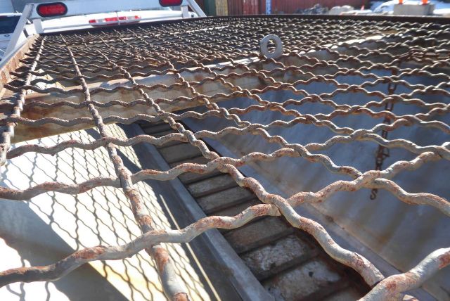 Truck bed with metal grid and rust; Chevrolet 2500HD pickup context text visible in listing description overlay. VIN 1GC2KVCG7BZ142496