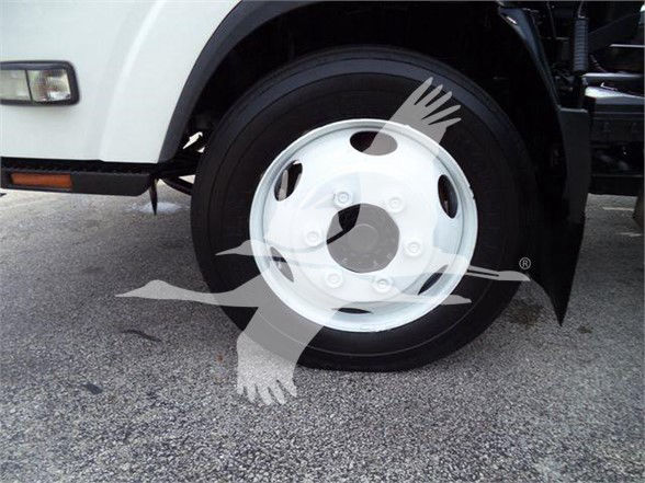 Isuzu NRR wheel showing white steel rim and tire.
