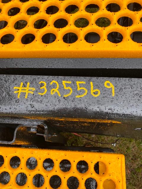 Yellow metal truck access steps with perforated holes and a central gray beam marked with handwritten yellow numbers '#325569'