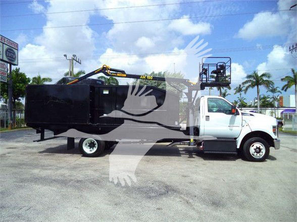 Flatbed grapple truck with white cab and black grapple bed. Visible text: not clearly legible on decals due to watermark. Overall, no specific model text readable from image.