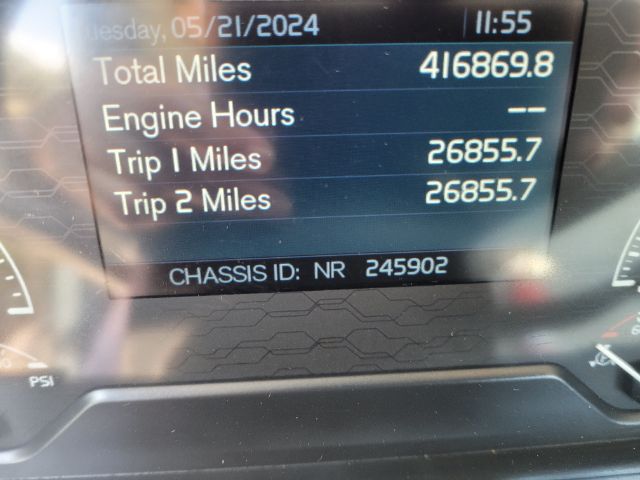 Dashboard display shows: Total Miles 416869.8, Engine Hours --, Trip 1 Miles 26855.7, Trip 2 Miles 26855.7, CHASSIS ID: NR 245902. Date/time display at top shows Tuesday, 05/21/2024 11:55.