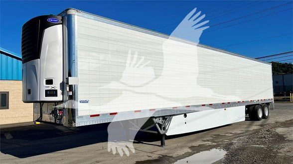 Reefer trailer with Vanguard Cool Globe logo, white exterior, refrigerated unit at front left, tandem axle, side view.