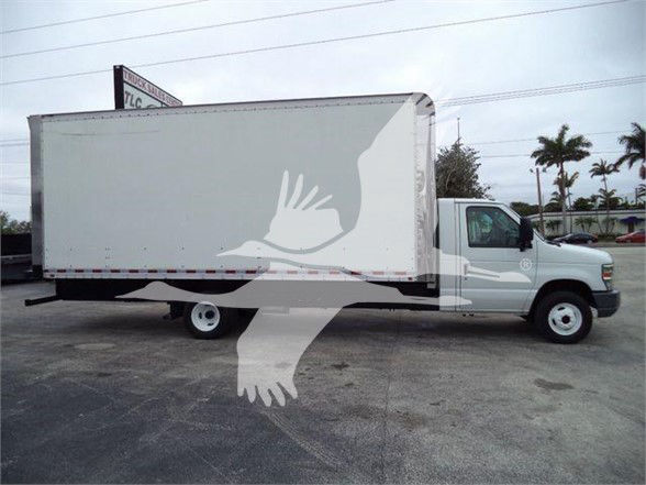 2011 Ford E450 box truck side profile showing cargo box and cab with white exterior.